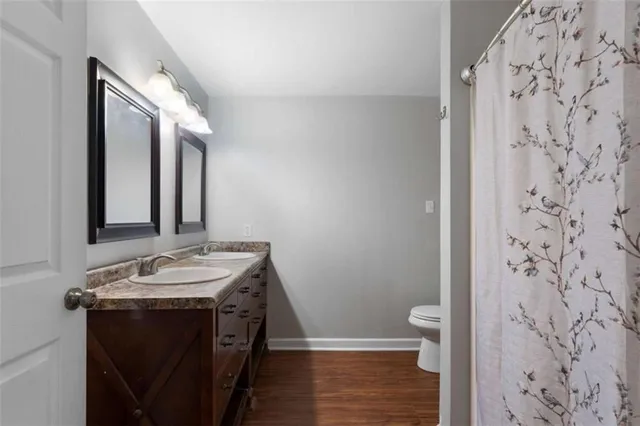 a bedroom with a bed and a ceiling fan