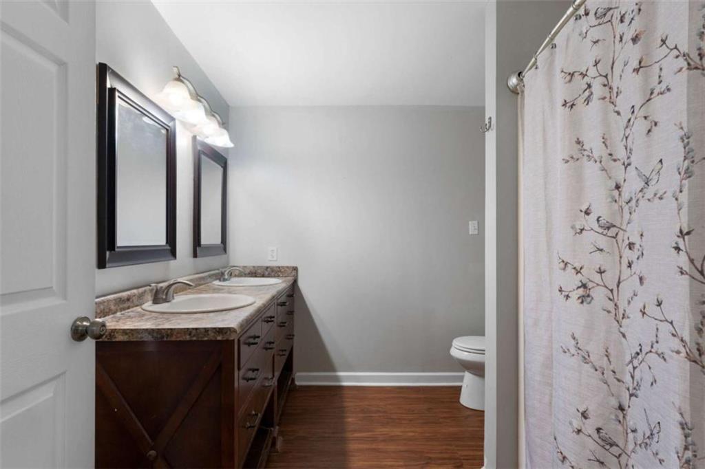 159 Moores Ferry Road Southwest Plainville, GA 30733 - Photo 34 of 43 a bathroom with a sink and a mirror