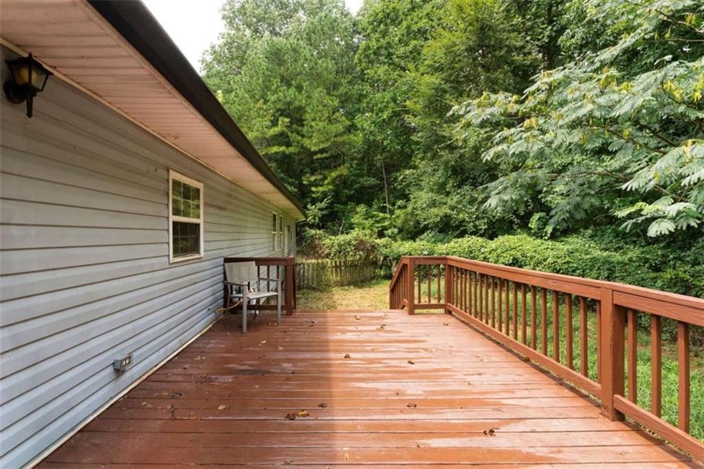 159 Moores Ferry Road Southwest Plainville, GA 30733 - Photo 37 of 43 a balcony with wooden floor and outdoor seating
