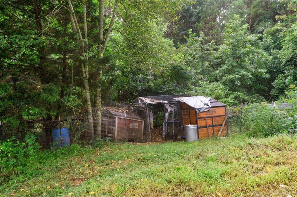 159 Moores Ferry Road Southwest Plainville, GA 30733 - Photo 39 of 43 a view of a house with a backyard and balcony