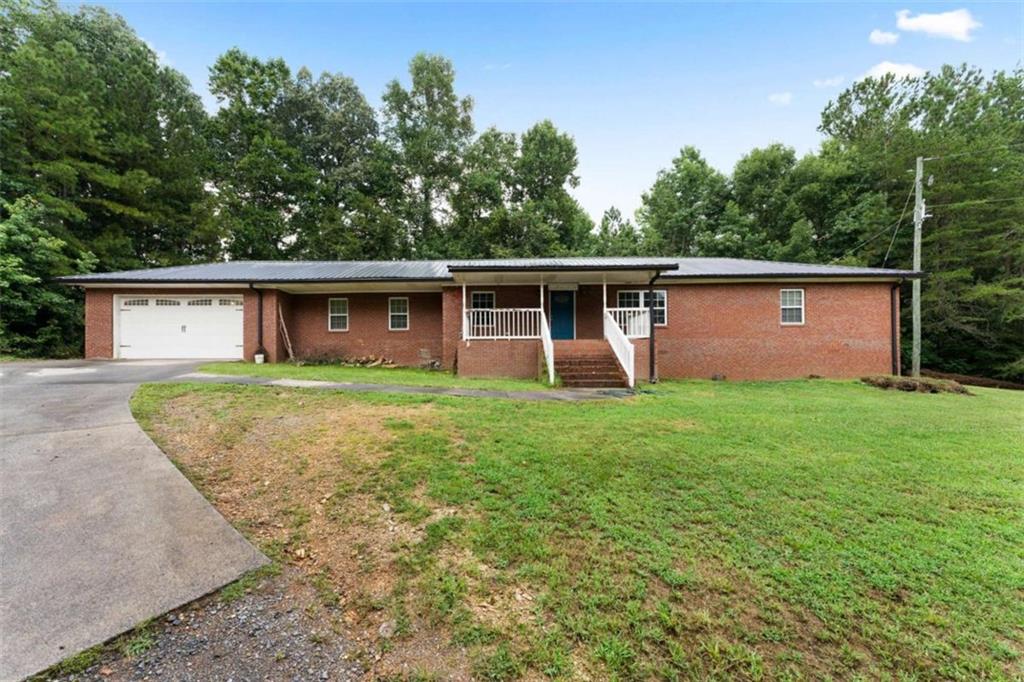 159 Moores Ferry Road Southwest Plainville, GA 30733 - Photo 9 of 43 front view of a house with a yard