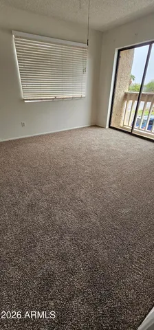a view of an empty room and window