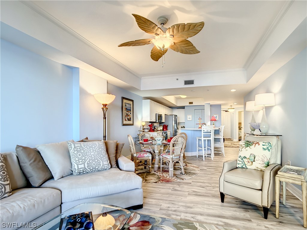 2797 First Street, Unit 1502 Fort Myers, FL 33916 - Photo 12 of 49 a living room with furniture and kitchen view