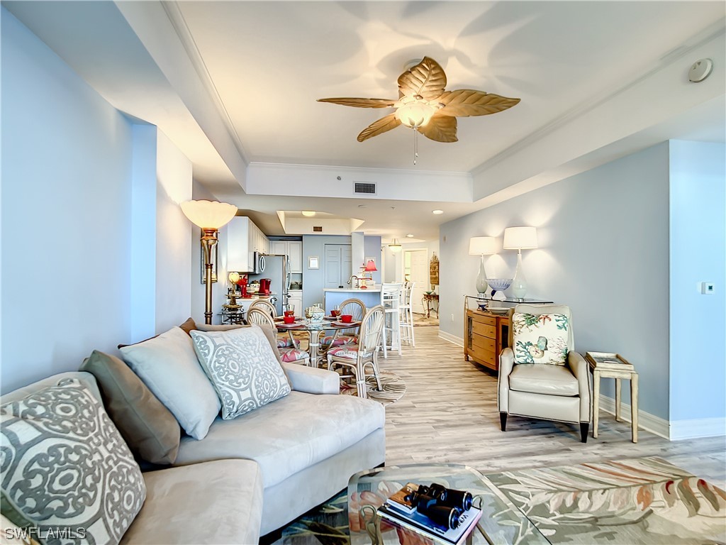 2797 First Street, Unit 1502 Fort Myers, FL 33916 - Photo 13 of 49 a living room with furniture and a chandelier