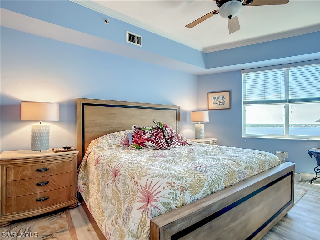 2797 First Street, Unit 1502 Fort Myers, FL 33916 - Photo 14 of 49 a bedroom with a bed and a window