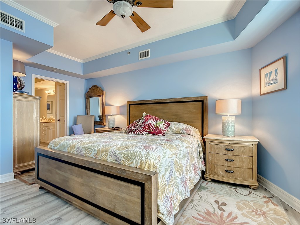 2797 First Street, Unit 1502 Fort Myers, FL 33916 - Photo 15 of 49 a bedroom with a bed and a dresser
