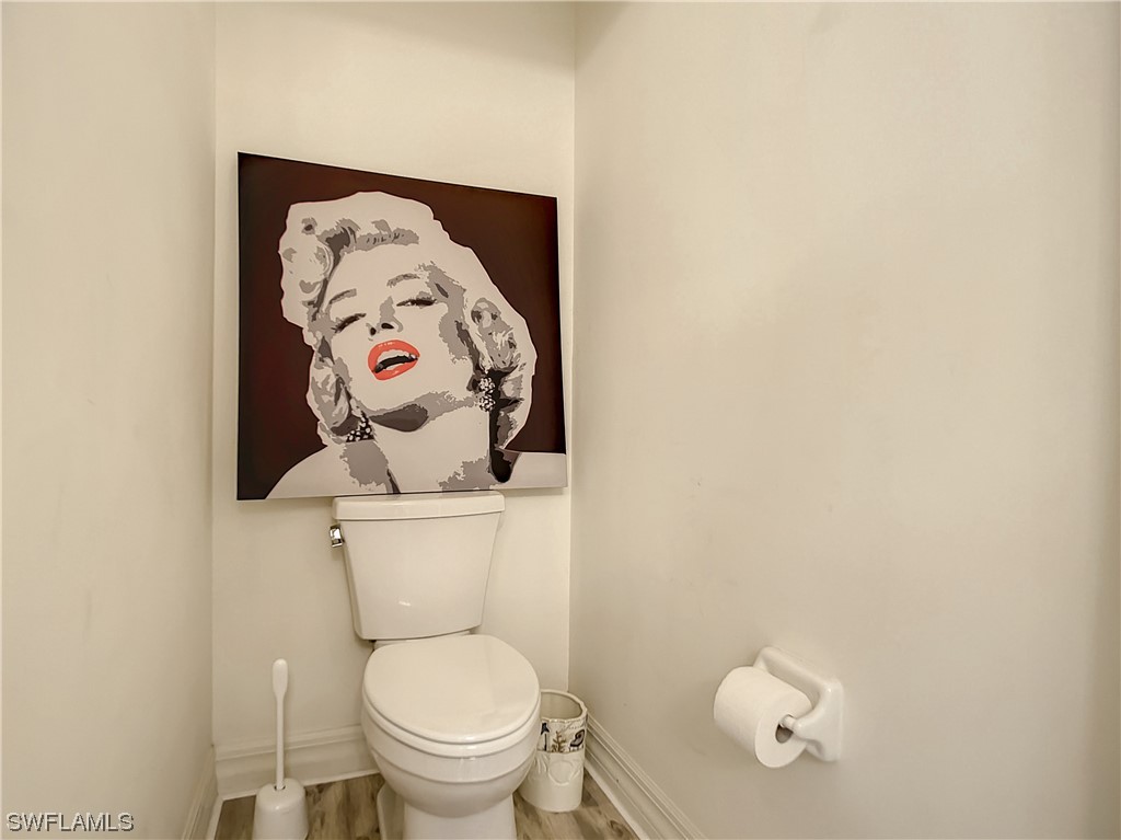 2797 First Street, Unit 1502 Fort Myers, FL 33916 - Photo 20 of 49 a white toilet sitting next to a white wall