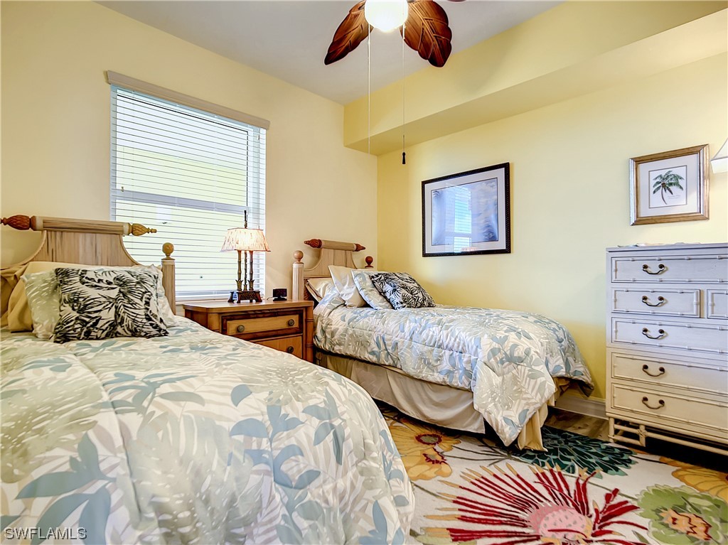 2797 First Street, Unit 1502 Fort Myers, FL 33916 - Photo 22 of 49 a bedroom with two beds and painting on the wall