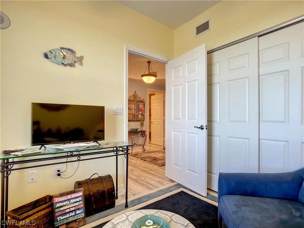 2797 First Street, Unit 1502 Fort Myers, FL 33916 - Photo 27 of 49 a living room with furniture and a flat screen tv