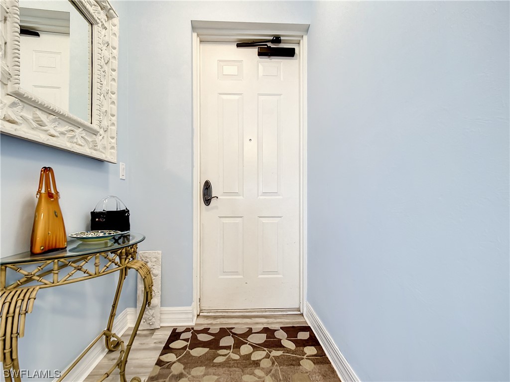 2797 First Street, Unit 1502 Fort Myers, FL 33916 - Photo 34 of 49 a view of walk in closet with clothes and shoes