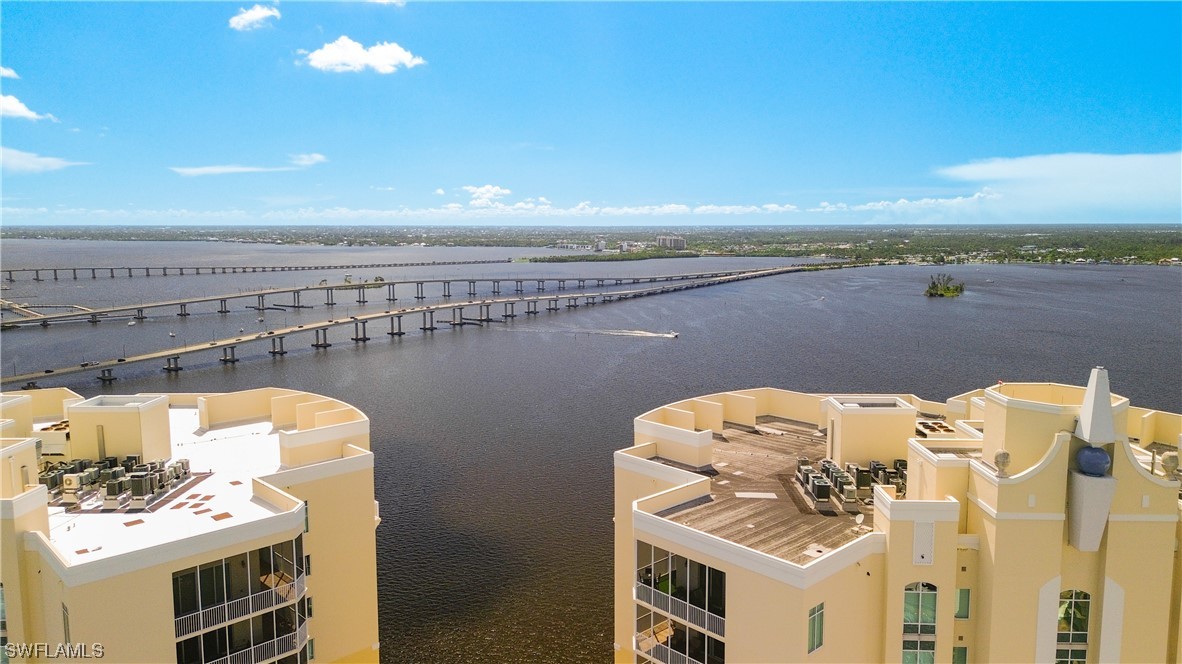 2797 First Street, Unit 1502 Fort Myers, FL 33916 - Photo 41 of 49 a view of roof deck with outdoor seating and ocean view