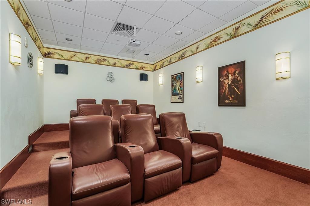 2797 First Street, Unit 1502 Fort Myers, FL 33916 - Photo 48 of 49 a media room with lots of chairs and wooden floor