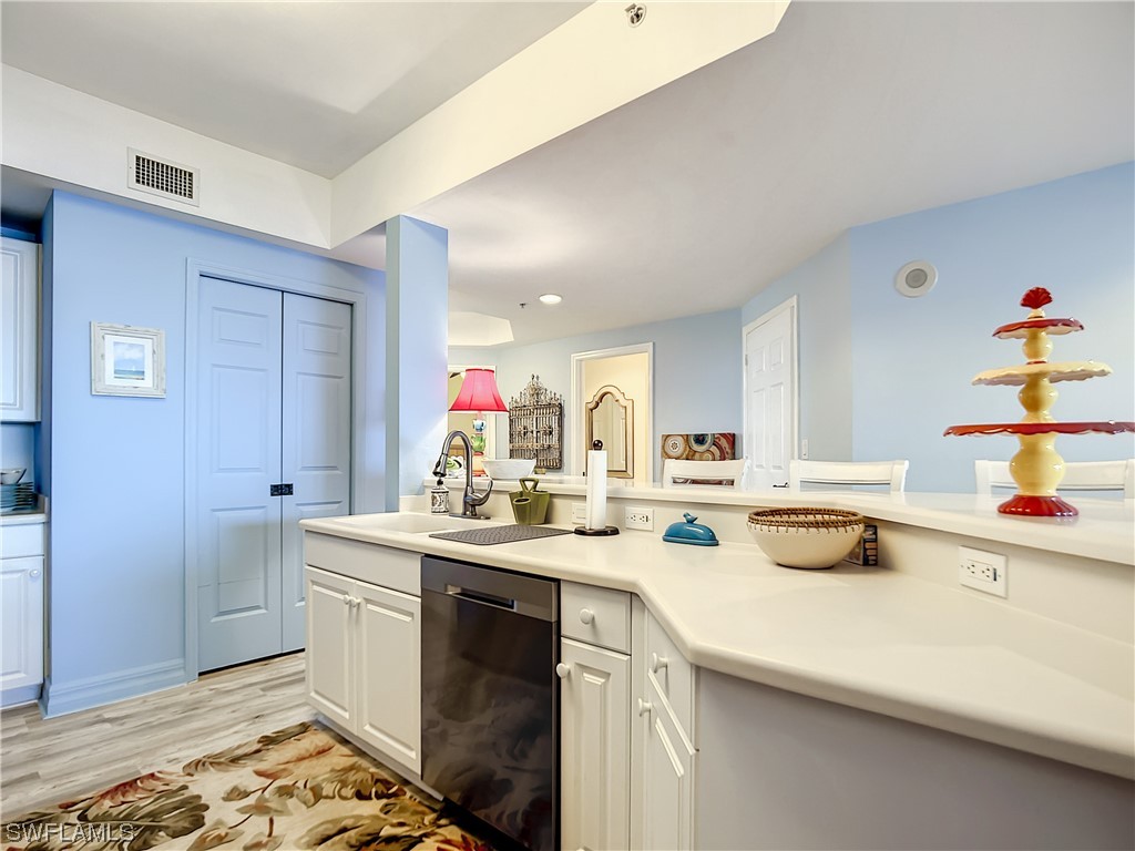 2797 First Street, Unit 1502 Fort Myers, FL 33916 - Photo 5 of 49 a kitchen with a sink and cabinets