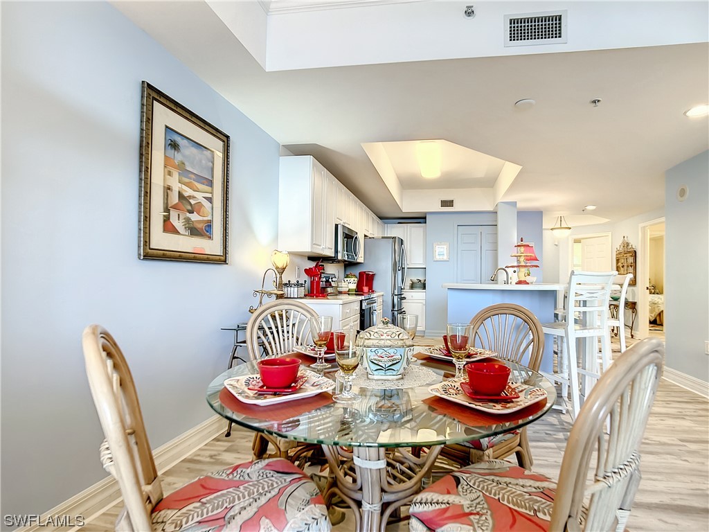 2797 First Street, Unit 1502 Fort Myers, FL 33916 - Photo 9 of 49 a outdoor dining space with furniture and a rug