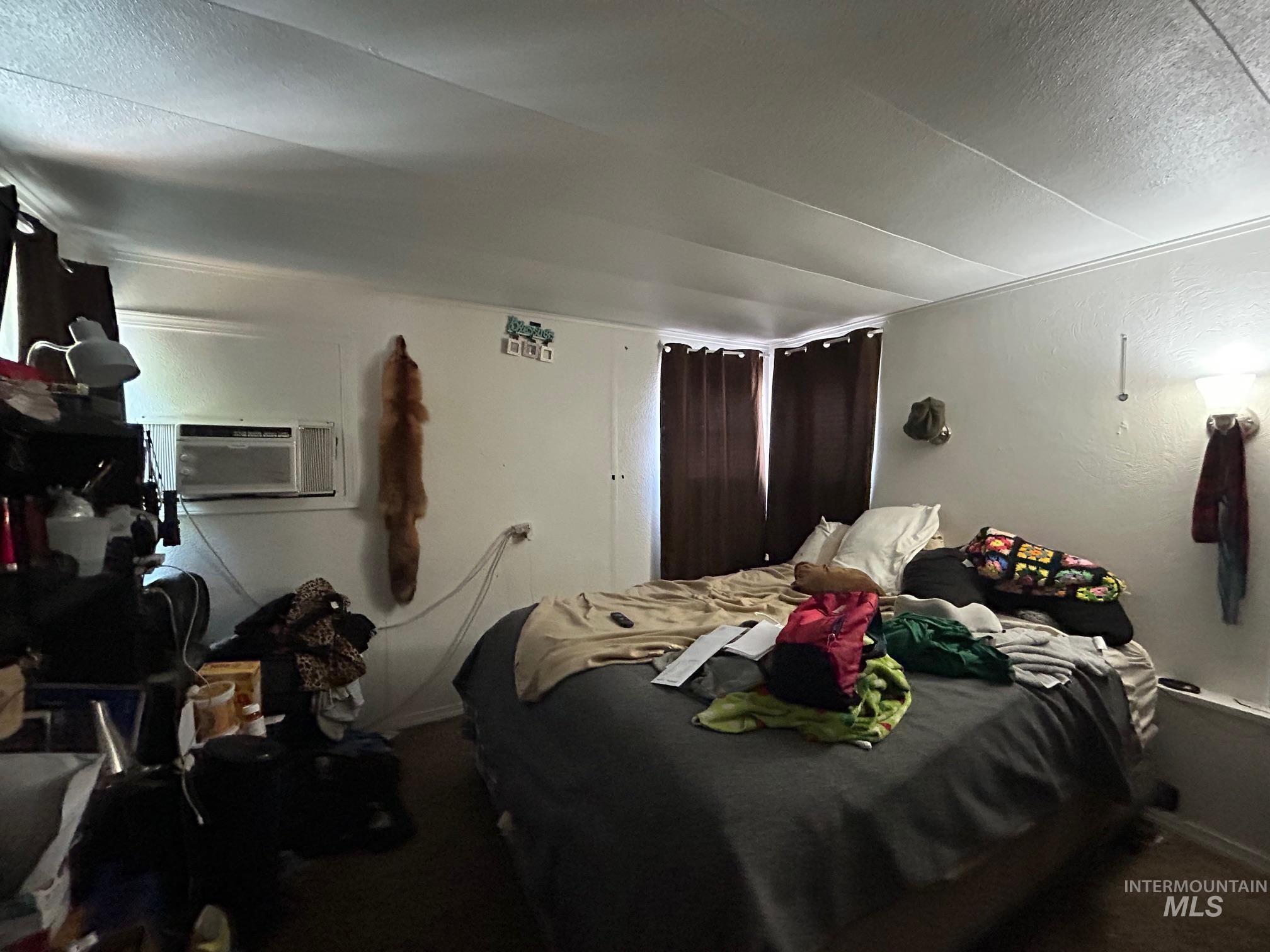 1383 Fair Street, Unit 7 Clarkston, WA 99403 - Photo 14 of 15 Bedroom featuring a textured ceiling