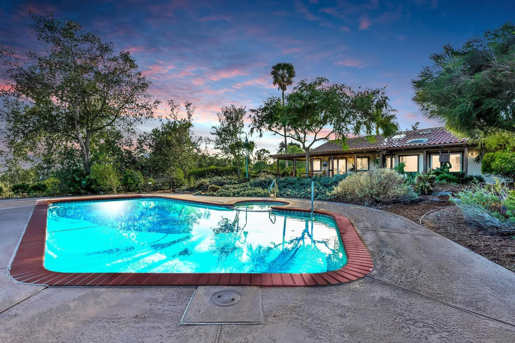 a view of a swimming pool with a patio