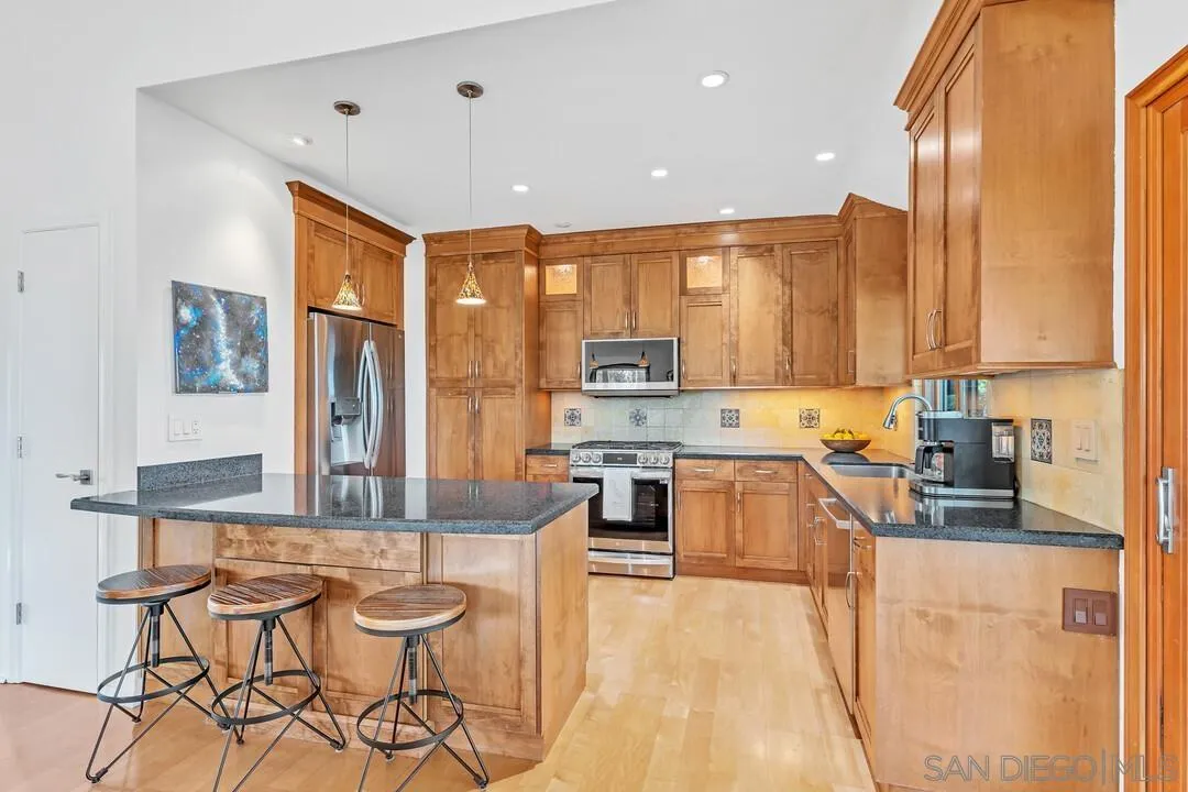 290 North Old Hill Road Fallbrook, CA 92028 - Photo 11 of 47 a kitchen with stainless steel appliances granite countertop counter space a sink and cabinets