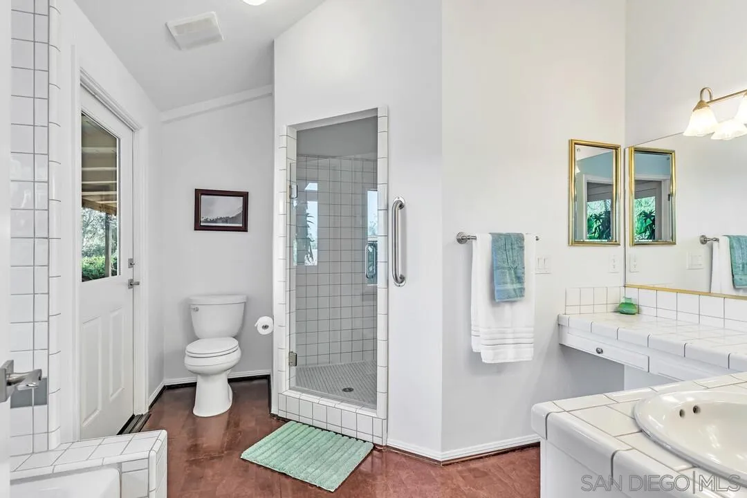 290 North Old Hill Road Fallbrook, CA 92028 - Photo 14 of 47 a bathroom with a sink a toilet and shower