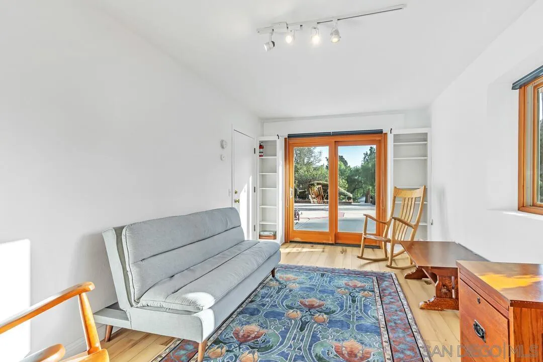 290 North Old Hill Road Fallbrook, CA 92028 - Photo 23 of 47 a living room with furniture and a floor to ceiling window