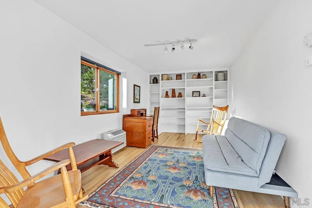 290 North Old Hill Road Fallbrook, CA 92028 - Photo 24 of 47 a living room with furniture a rug and white walls