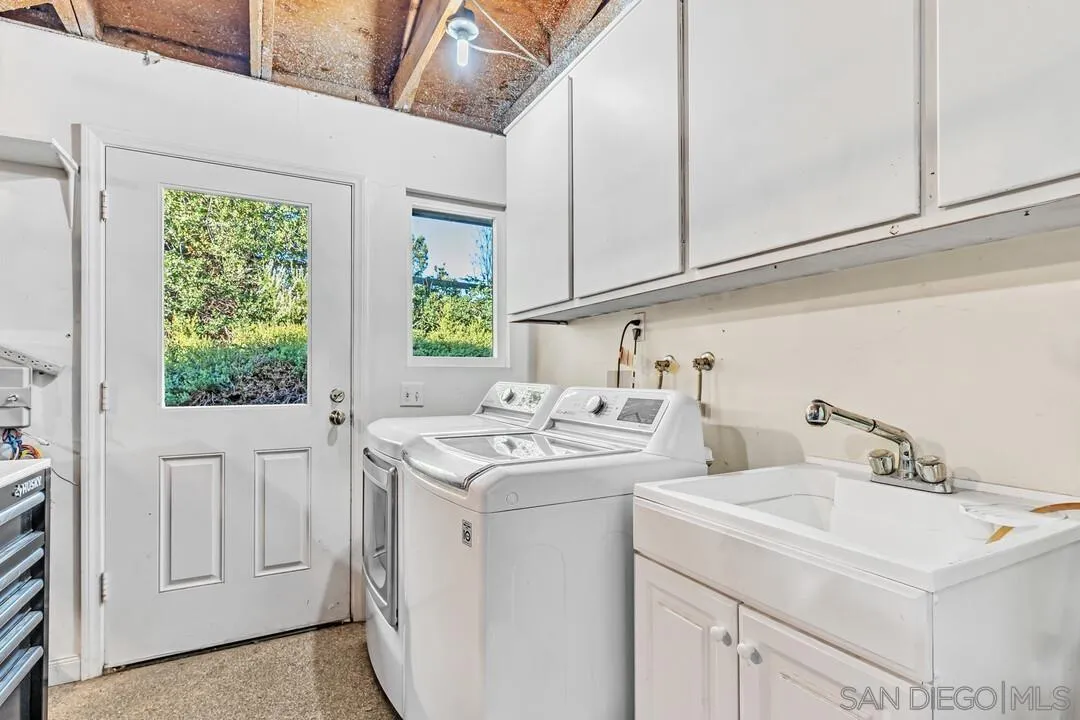 290 North Old Hill Road Fallbrook, CA 92028 - Photo 25 of 47 a view of a sink and dishwasher with washer dryer