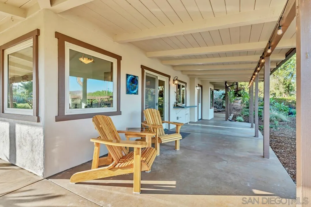 290 North Old Hill Road Fallbrook, CA 92028 - Photo 26 of 47 a dining room with wooden floor and windows