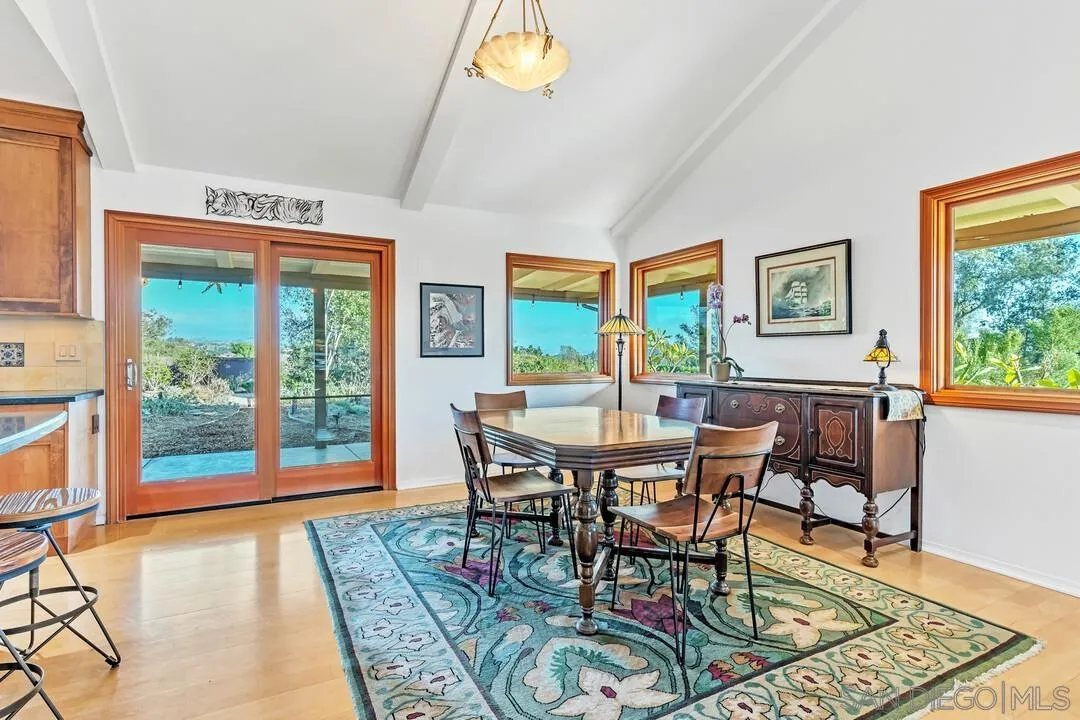 290 North Old Hill Road Fallbrook, CA 92028 - Photo 8 of 47 a view of a dining room with furniture a rug and wooden floor