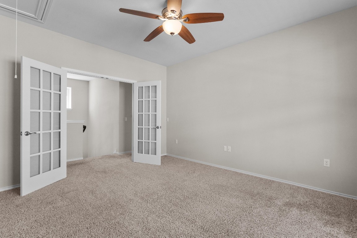 9416 Hunter Lane Austin, TX 78748 - Photo 17 of 35 an empty room with windows and fan