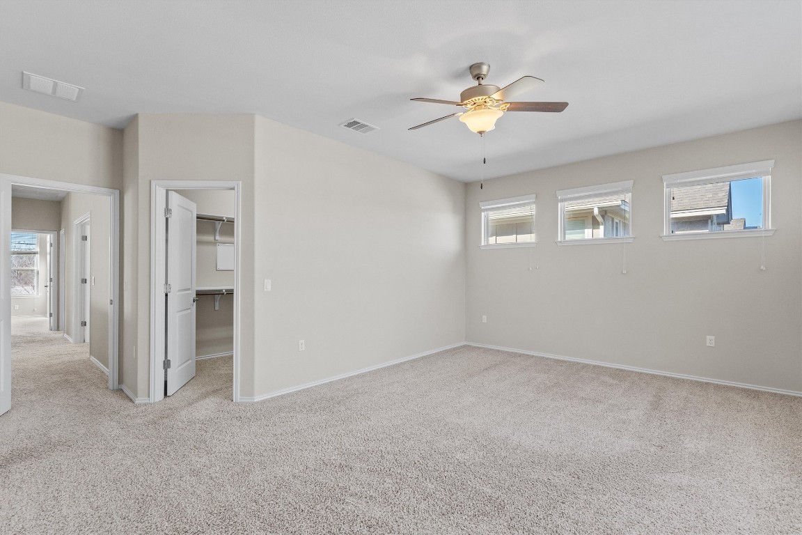 9416 Hunter Lane Austin, TX 78748 - Photo 20 of 35 a view of an empty room with a ceiling fan