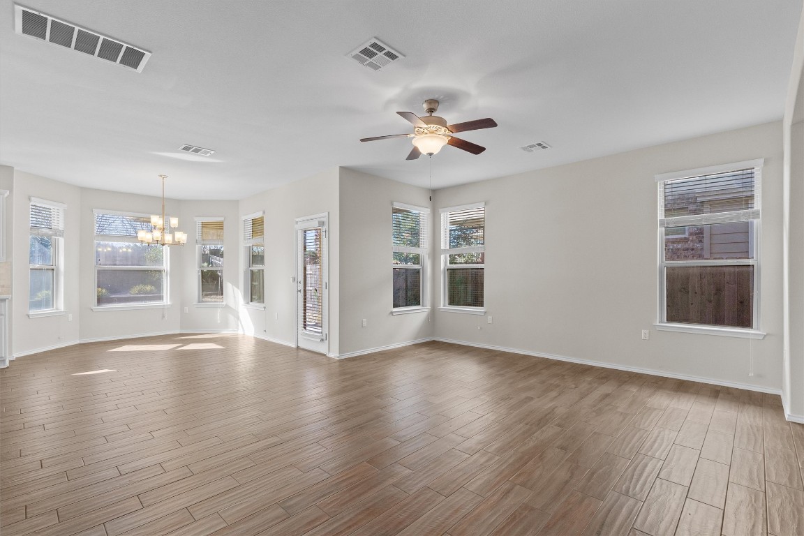 9416 Hunter Lane Austin, TX 78748 - Photo 5 of 35 a view of an empty room with a window and wooden floor
