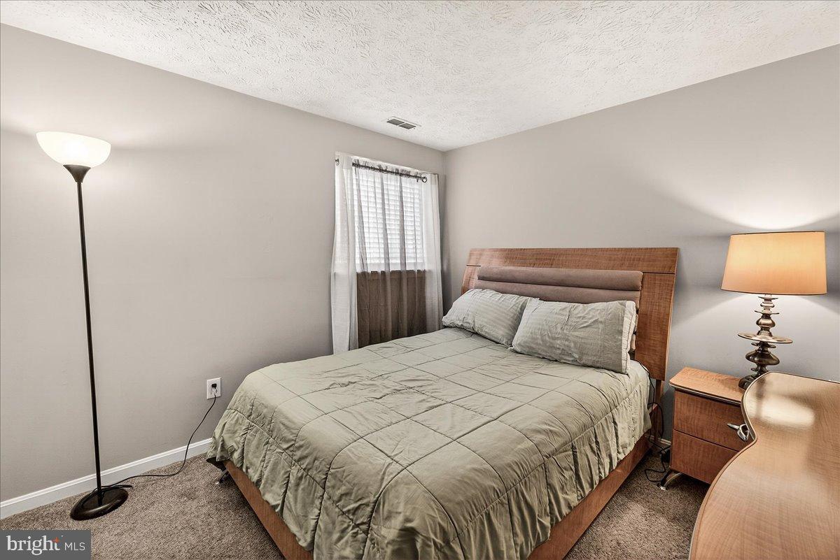 2141 Wainwright Court, Unit BA Frederick, MD 21702 - Photo 19 of 42 Cozy bedroom with soft, inviting tones.