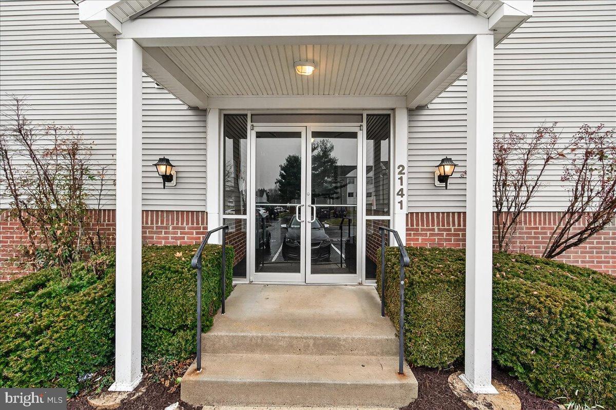 2141 Wainwright Court, Unit BA Frederick, MD 21702 - Photo 2 of 42 Inviting entrance with lush greenery.
