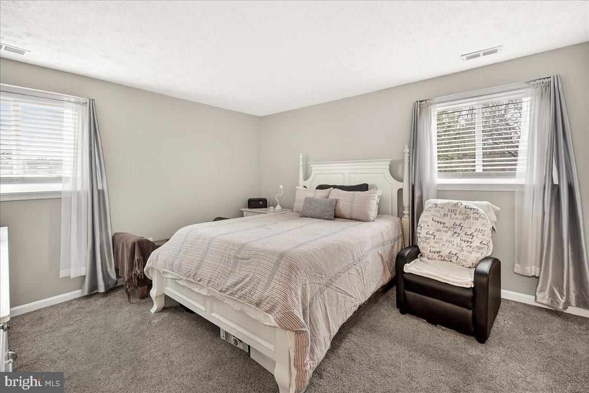2141 Wainwright Court, Unit BA Frederick, MD 21702 - Photo 21 of 42 Serene bedroom with natural light and comfort.
