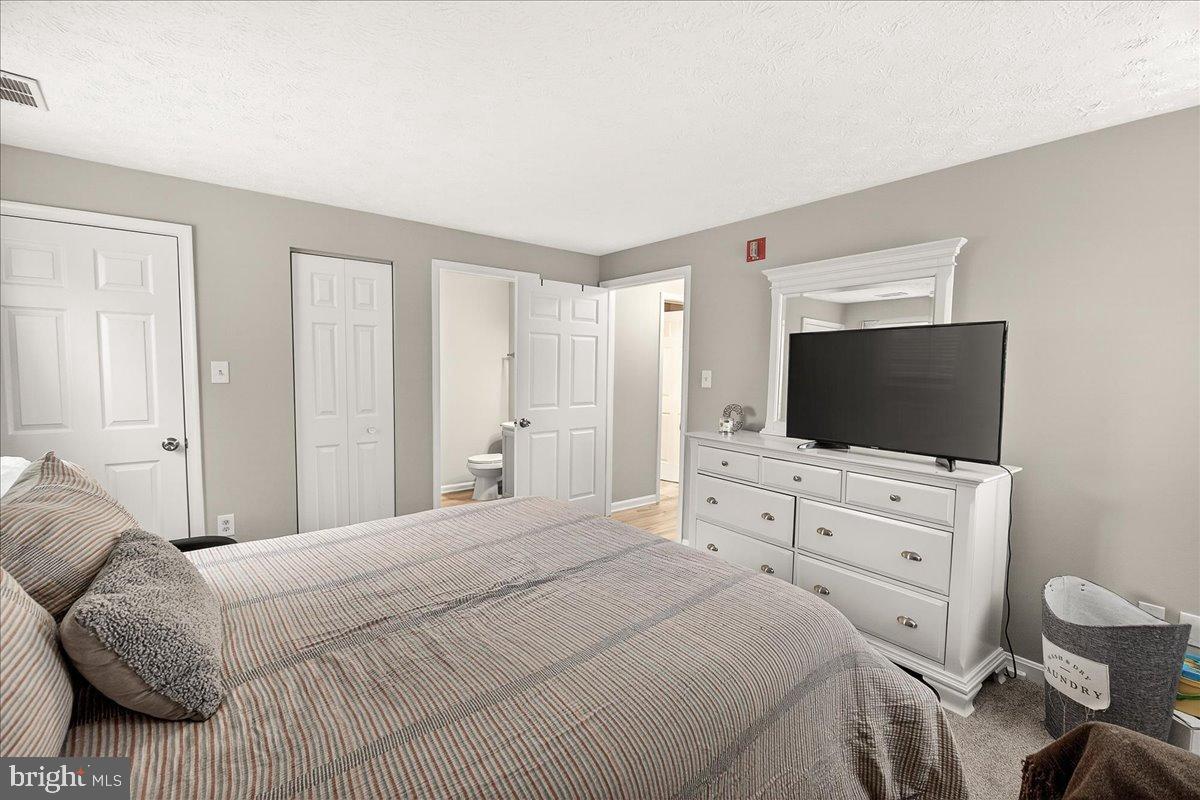 2141 Wainwright Court, Unit BA Frederick, MD 21702 - Photo 22 of 42 Cozy bedroom with neutral tones and doors.