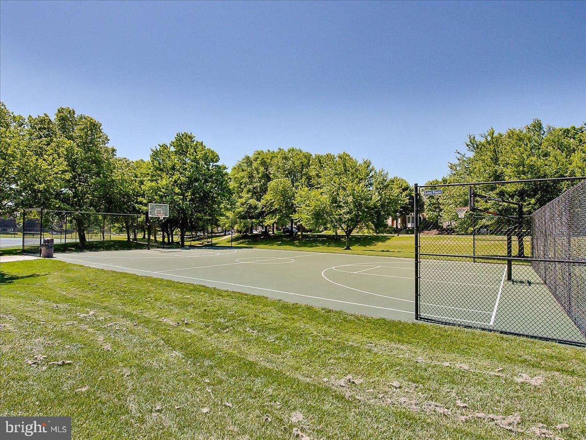 2141 Wainwright Court, Unit BA Frederick, MD 21702 - Photo 35 of 42 Sunny court surrounded by lush greenery.