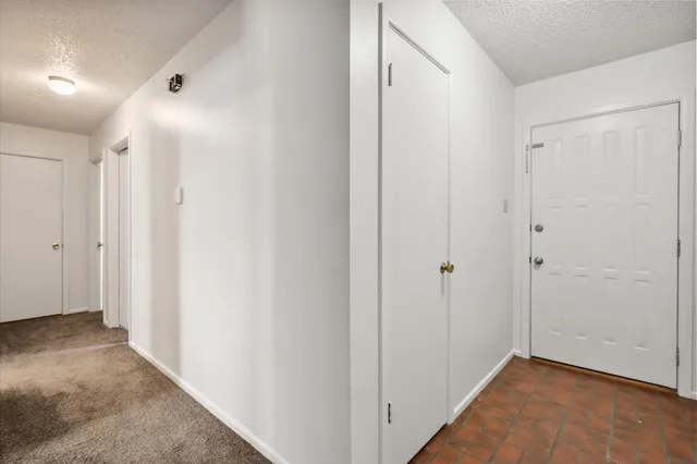 a view of hallway with closet