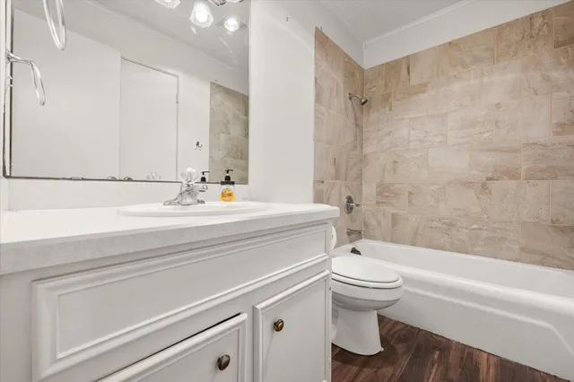 a bathroom with a sink a toilet and a bathtub