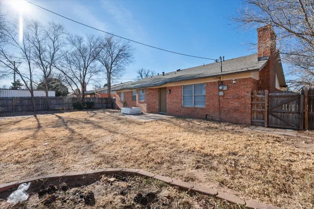 a house view with a backyard space