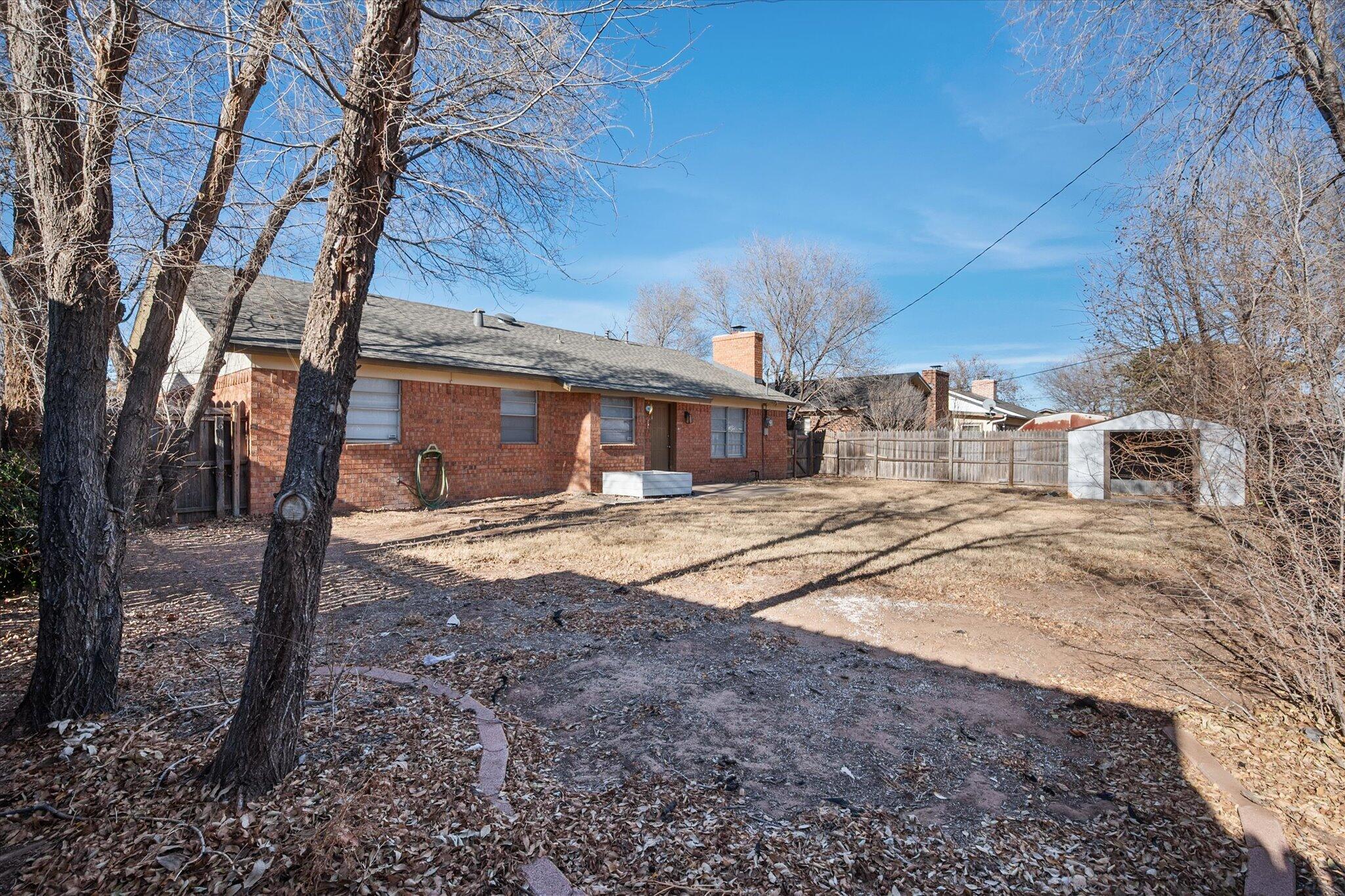 1503 Elkhart Avenue Lubbock, TX 79416 - Photo 28 of 28 a house view with a backyard space