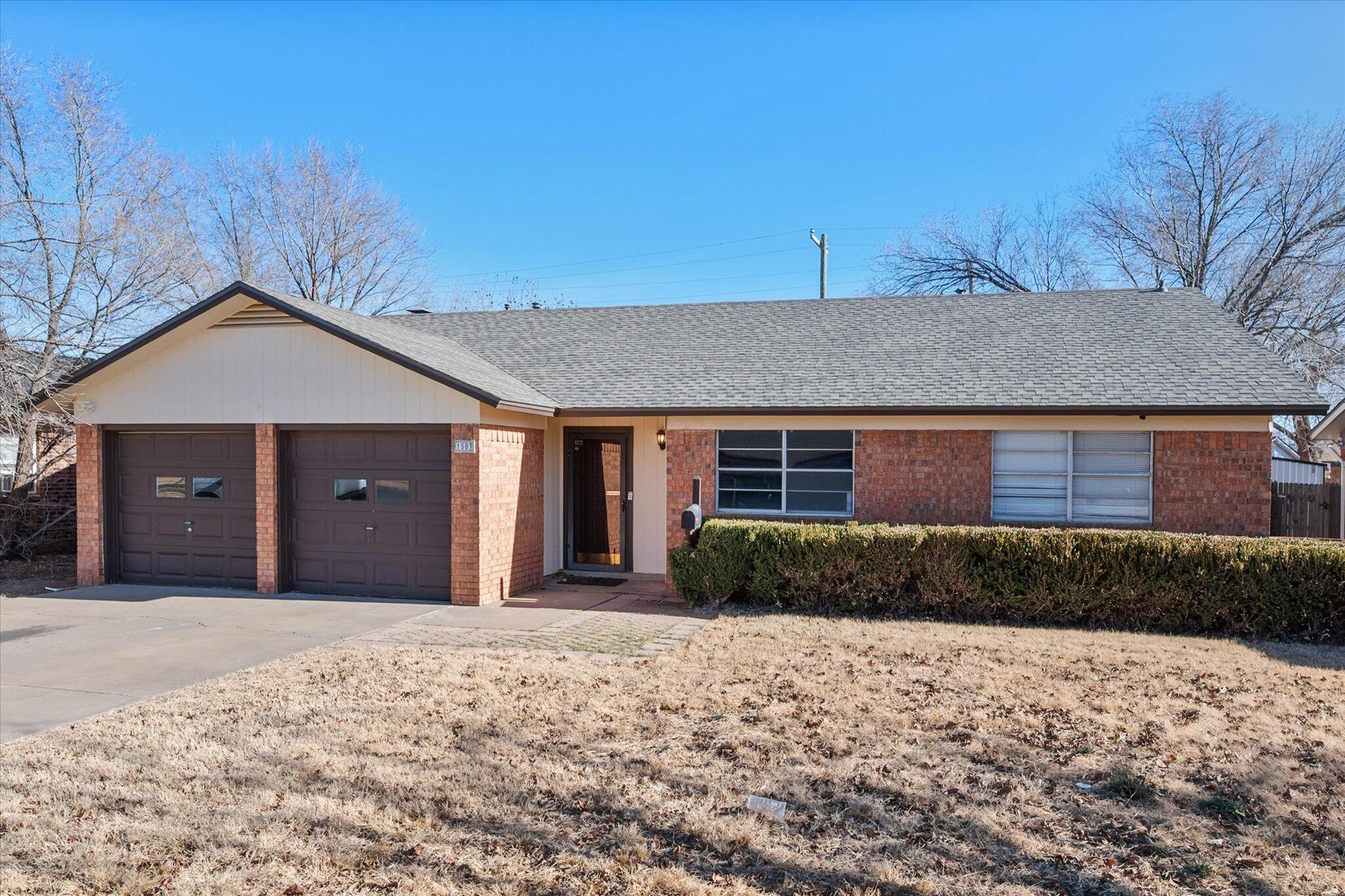 1503 Elkhart Avenue Lubbock, TX 79416 - Photo 4 of 28 a front view of a house with a yard