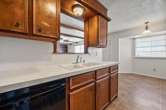 a kitchen with a sink and cabinets