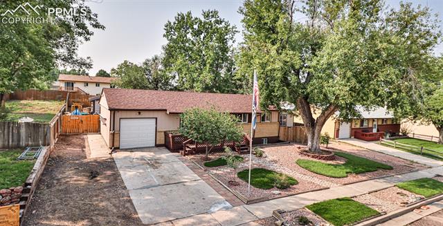 6727 Seneca Road Colorado Springs, CO 80915 - Photo 50 of 50 Removable gate allows for small car to pull through to workshop behind the home.