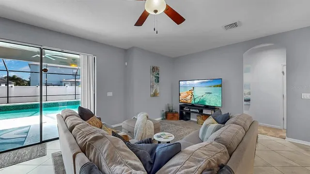 a living room with furniture and a flat screen tv