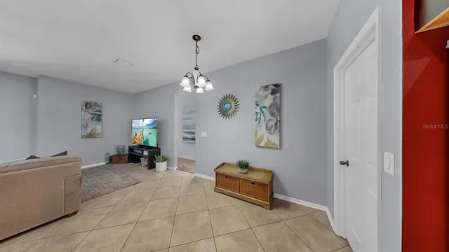 a view of a livingroom with furniture and a flat screen tv