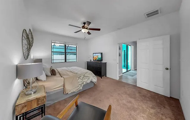 a spacious bathroom with a granite countertop sink and a mirror