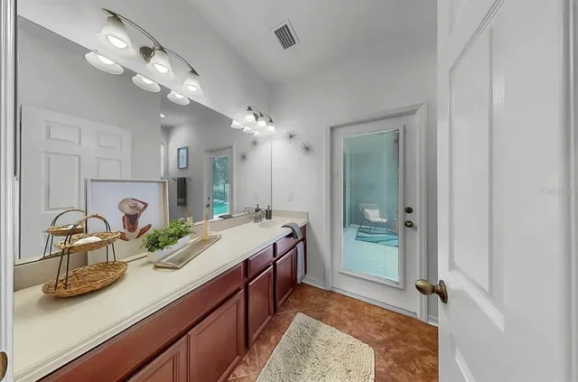 an aerial view of a house with garden space and street view