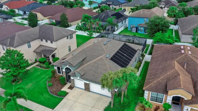 an aerial view of a house with outdoor space