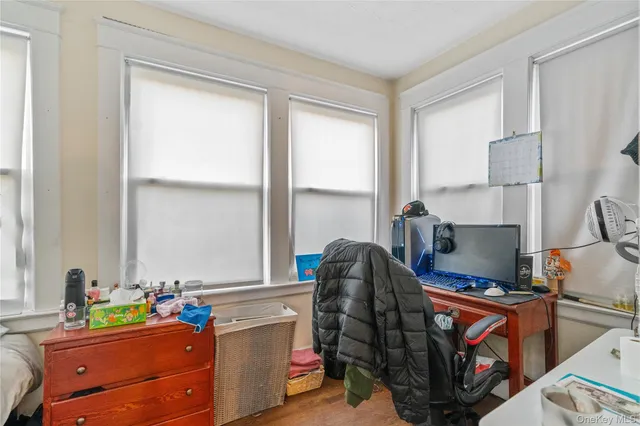 a bedroom with a bed and a table