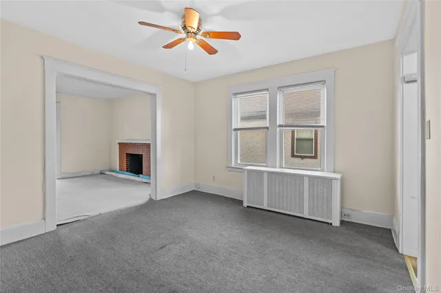 a kitchen with granite countertop a sink stove and refrigerator
