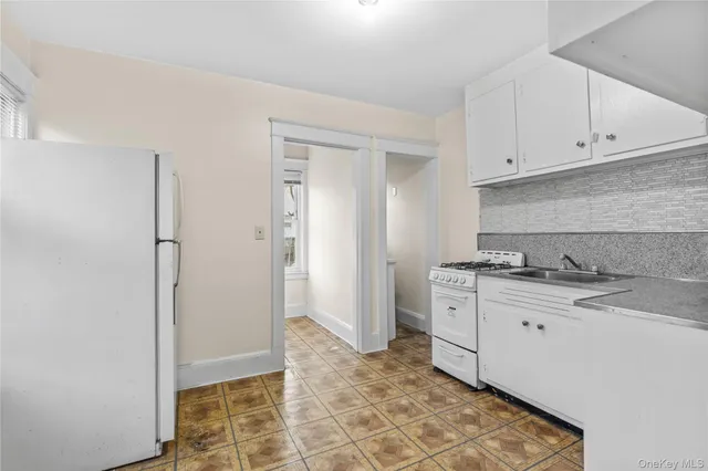 a kitchen with a stove and cabinets